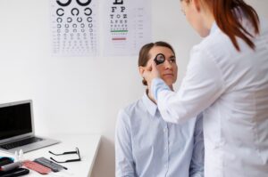 Eye doctor examining a patient's vision during an eye exam